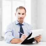 service professional takes notes of qualifying sales questions